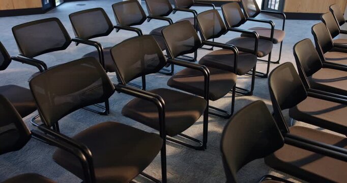 Seats, seminar and empty hall for event, business forum and conference with meeting venue. Chairs, room and interior at convention center with rows for summit, presentation and furniture for workshop