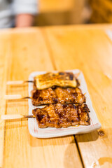 Kushiyaki, food items skewered on wooden skewers Kushiyaki, food items skewer on wooden skewers served on plate