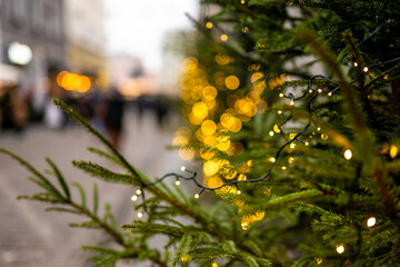 Christmas Street With Pine Branch In The Foreground Soft Focus