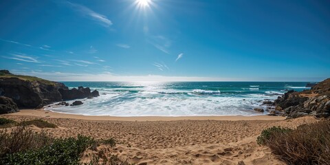 Blue sky and ocean waves crashing on rocky coastline, natural erosion processes