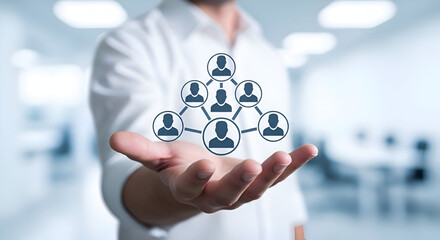 Businessman presents digital network structure with connected user icons floating above his open hand in a bright modern office setting