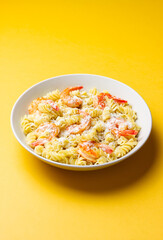 Pasta in a creamy sauce with shrimp and cheese. Italian cuisine.