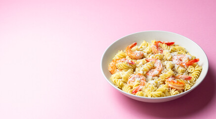 Pasta in a creamy sauce with shrimp and cheese. Italian cuisine.