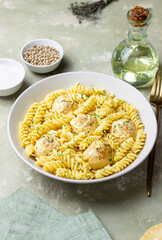 Pasta with chicken meatballs in a creamy sauce. Italian cuisine. Recipe.
