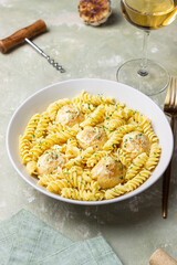 Pasta with chicken meatballs in a creamy sauce. Italian cuisine. Recipe.