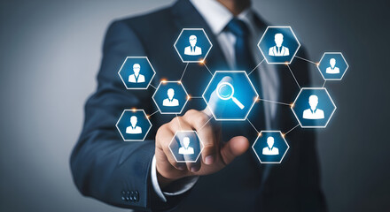 Businessman interacts with a glowing digital network of human resource icons connected by lines emphasizing talent acquisition and personnel search technology