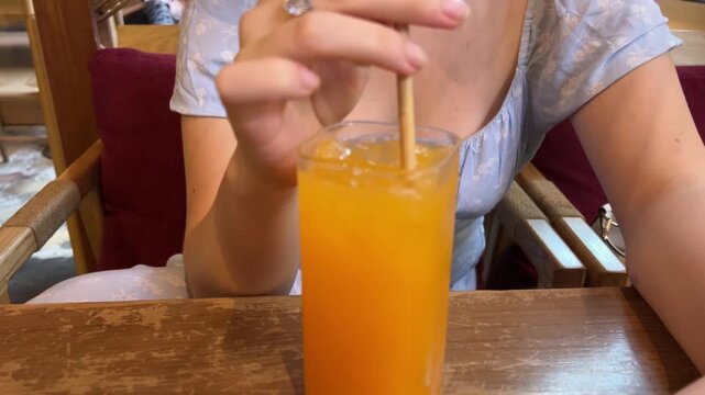 Tropical Fruit Juice with Cocktail Stirrer in Phuket Cafe