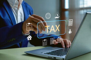 Businessman using smart pen on virtual tax interface with online accounting icons, digital tax filing, financial management system, audit process and business compliance technology.