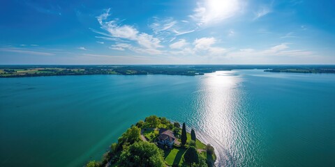 Naklejka premium Aerial view of a expansive lake highlighting water surface and surrounding landscape, suitable for environmental studies