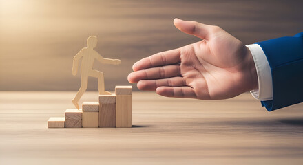 Wooden figure ascends stacked blocks toward a large outstretched hand symbolizing mentorship guidance career growth and opportunity on a wooden surface
