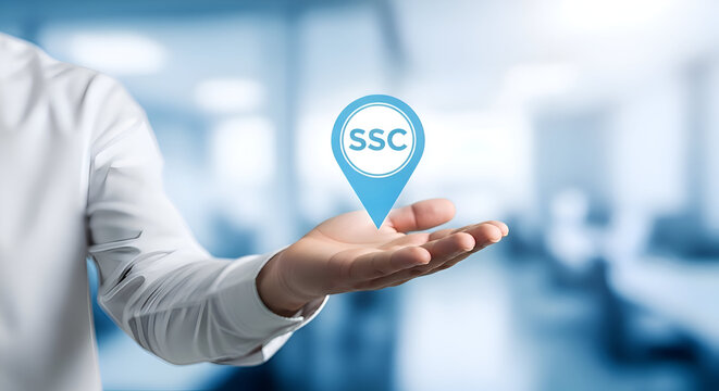 Professional hand presenting a glowing blue location pin icon with ssc acronym inside against a soft focus corporate office background for service delivery