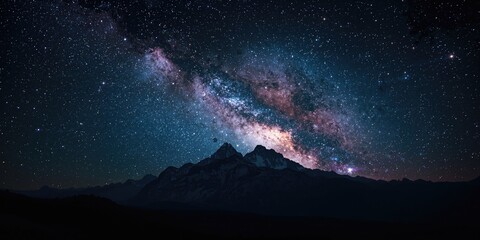 Obraz premium Nighttime scene of mountains with a star-filled sky, ideal for use as a UI backdrop or visual separator
