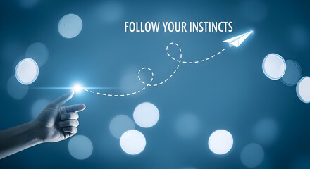 Human finger points toward a glowing light source launching a paper airplane following a dashed trajectory against a blue bokeh background