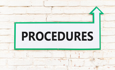 Procedures symbol. Concept word Procedures on beautiful white sign on old white brick wall. Beautiful brick old white wall background. Business procedures concept. Copy space.