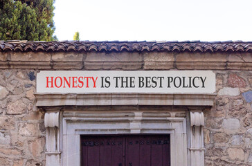 Honesty is the best policy symbol. Concept words Honesty is the best policy on beautiful white marble sign plate. Beautiful stone wall background. Business honesty is best policy concept. Copy space.