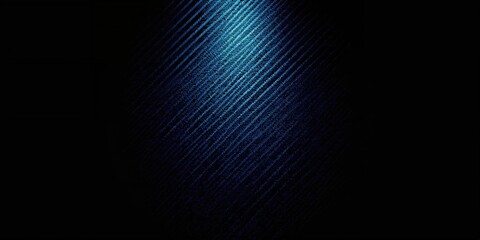 Obraz premium Spotlight effect on carbon fiber surface serving as a background for digital interfaces, lighting and material details