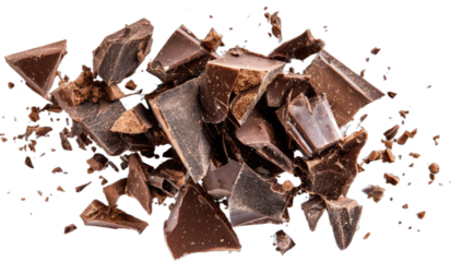 Dark chocolate chunks scattered across a black background