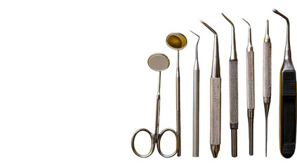 Various dental instruments arranged on a black background