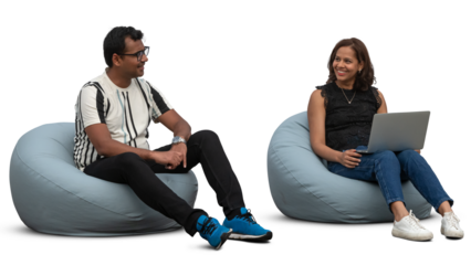 Two people sitting on bean chairs and talking and working with laptop, isolated on white and transparent background