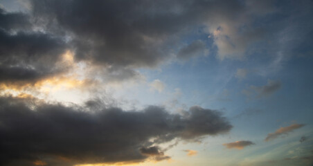 Dramatic sunset sky with clouds. Evening sky colors.