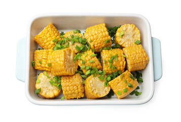 Pieces of boiled corncobs with green onion in baking dish isolated on white, top view