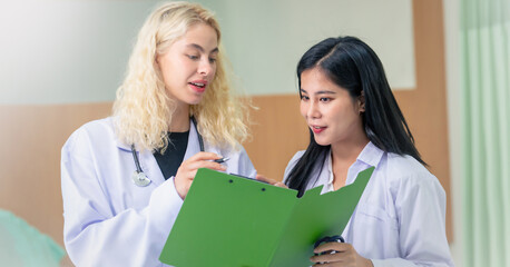 Professional Medical Doctors and team discussing in clinic hall, healthcare professionals having...