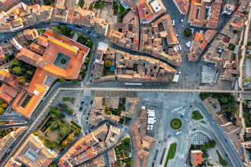 Aerial view of historic center of Segovia with medieval streets, stone buildings, central square.