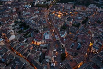 Night view of center of Segovia with medieval streets, central square and night lights. Spain.