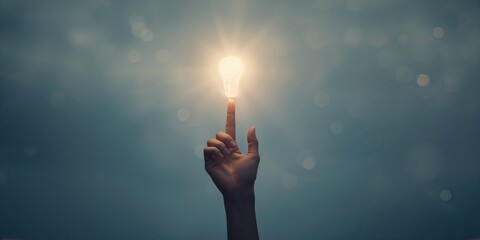 Close-up of a hand with a floating light bulb on finger, symbolizing idea generation and problem-solving, World Creativity and Innovation Day