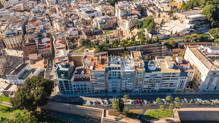 Santa Lucia in Cartagena, Spain, historic buildings, palm trees and Mediterranean urban landscape.