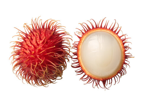 Fresh rambutan fruit with half sliced showing white juicy flesh isolated on white background