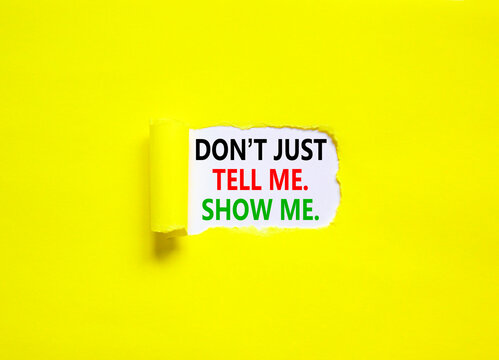 Tell or show symbol. Concept words Do not just tell me, show me on beautiful white paper. Beautiful yellow paper background. Business tell or show concept. Copy space.