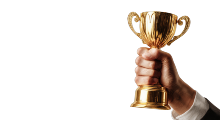 A hand in a suit sleeve holds a golden trophy against a black background