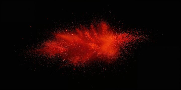 Cayenne pepper powder explosion on black background, spice dispersal
