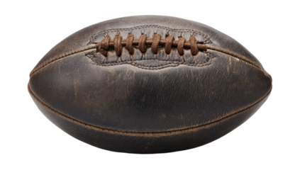 Vintage leather football with worn laces, isolated on black