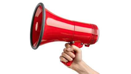 Red megaphone held in a hand, isolated on a black background