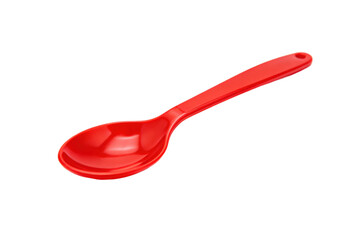 Red plastic spoon isolated on white background for kitchen use