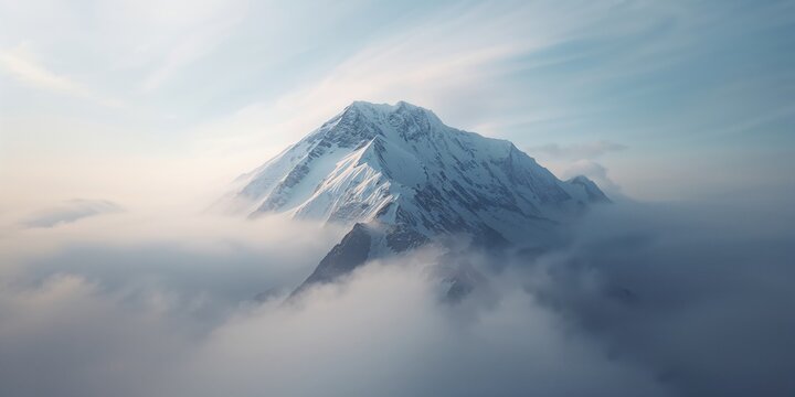 Foggy weather obscures the snowy mountain peak, highlighting erosion and winter conditions - Powered by Adobe
