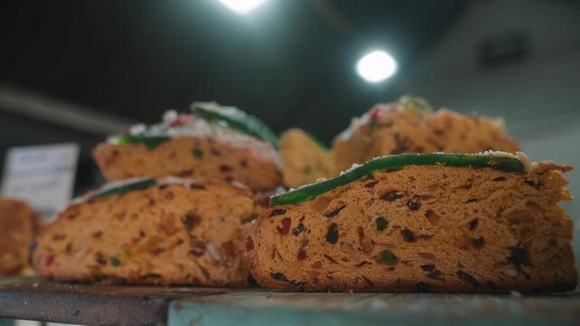 Artisanal baked biscotti with green icing on market tray