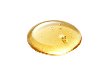 Golden viscous liquid drop on white background