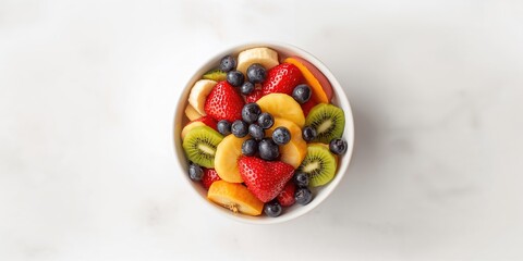 Colorful fruit salad in a bowl featuring ripe slices, designed as a vibrant background for food styling or editorial use
