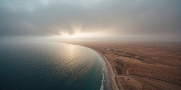 Bird's eye perspective of Concon coastal area with La Boca bay, Ritoque dunes, and Quintero city in the distance following rainfall and mist