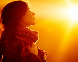 beautiful woman with a scarf enjoying the sunset