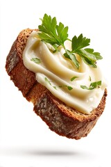 Rye bread floating with creamy spread and fresh parsley, preparing a tasty appetizer snack