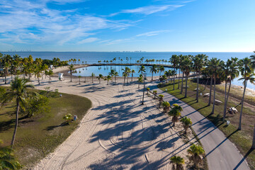 Naklejka premium Aerial view of tropical lagoon next to the ocean during beautiful sunrise and blue sky