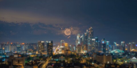 Obraz premium Nighttime cityscape with urban development in the foreground, hazy sky in the background, illuminated circular light feature, Earth Day