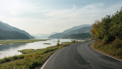 Winding road along the water's edge used for transportation routes, focusing on urban accessibility
