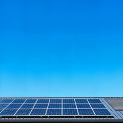 Solar panels installed on a modern house rooftop under a clear blue sky. Concept of sustainable living, renewable green energy, and environmental technology. Wide angle shot with copy space.