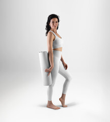 Template of white floor mat for yoga, rolled up, trainer dressed in training suit, isolated on background.