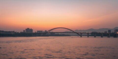 Naklejka premium Banpo Bridge in Seoul, South Korea with blurred sky bokeh during sunset, urban infrastructure at dusk
